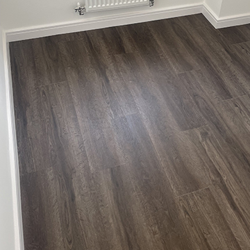 Brown plank LVT fitted in room